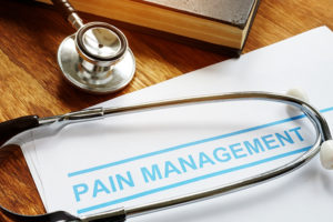 Stethoscope and document with Pain Management title