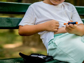 child injecting insulin