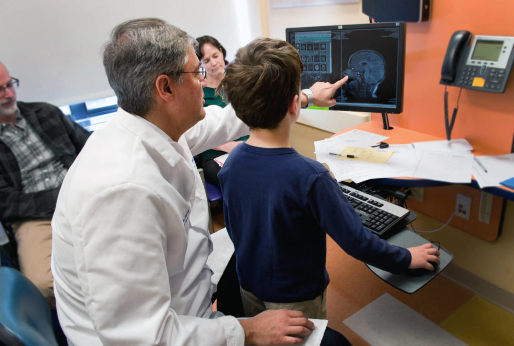Dr. Rivkin works with a patient.
