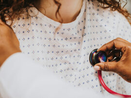 Physician examining a patient's heart